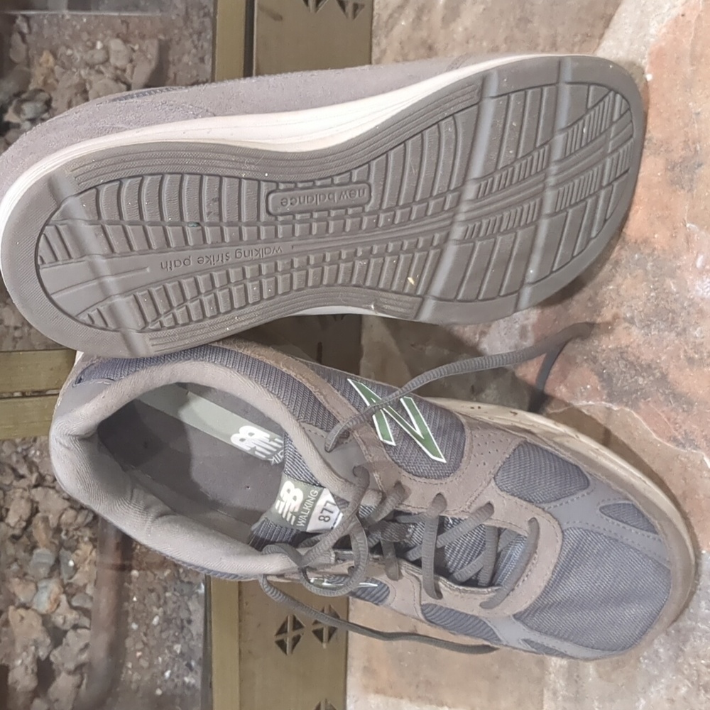 Grey New Balance shoes with green details